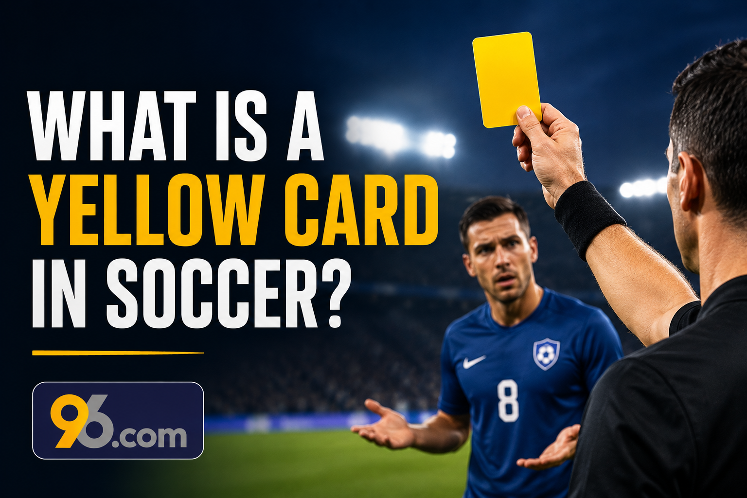 What Is a Yellow Card in Soccer - about96.com | Sports What is a yellow card in soccer? Referee raises a yellow card as a player looks on; 96.com logo at bottom left.